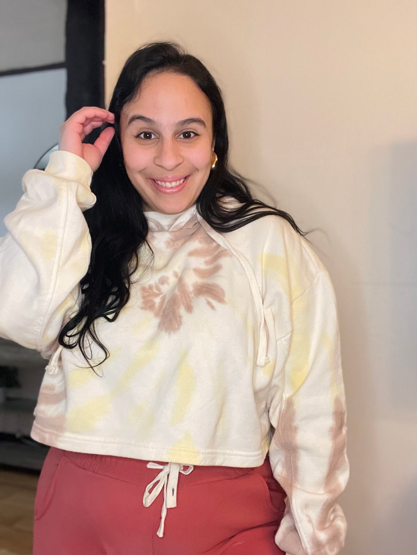 Colorful tie-dye cropped hoodie with a relaxed fit and vibrant pattern