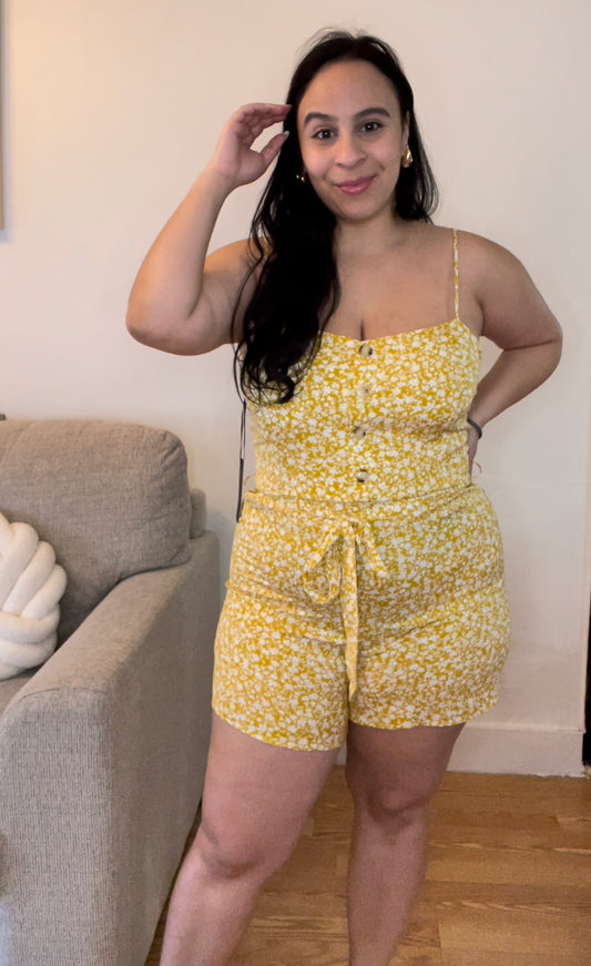 Yellow belted romper with white flowers and adjustable straps