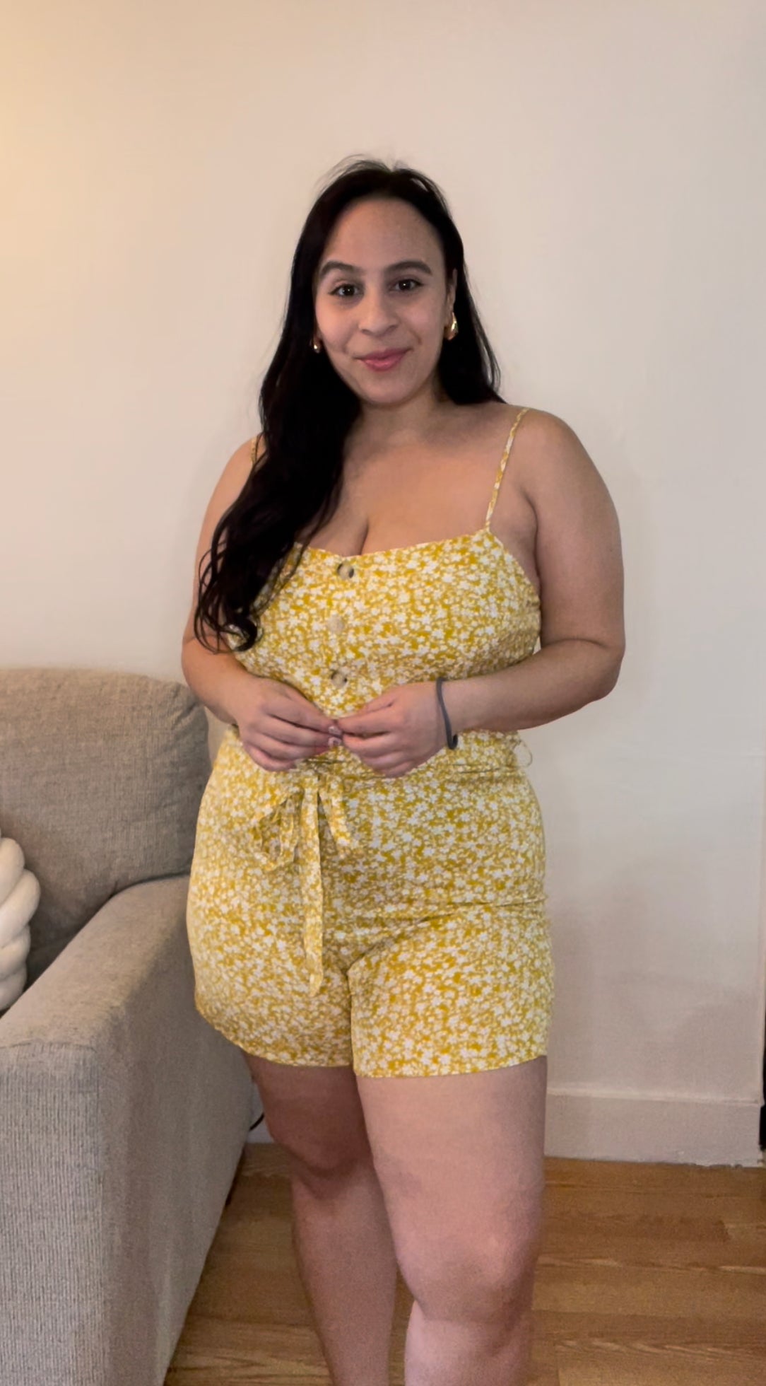 Yellow belted romper with white flowers and adjustable straps