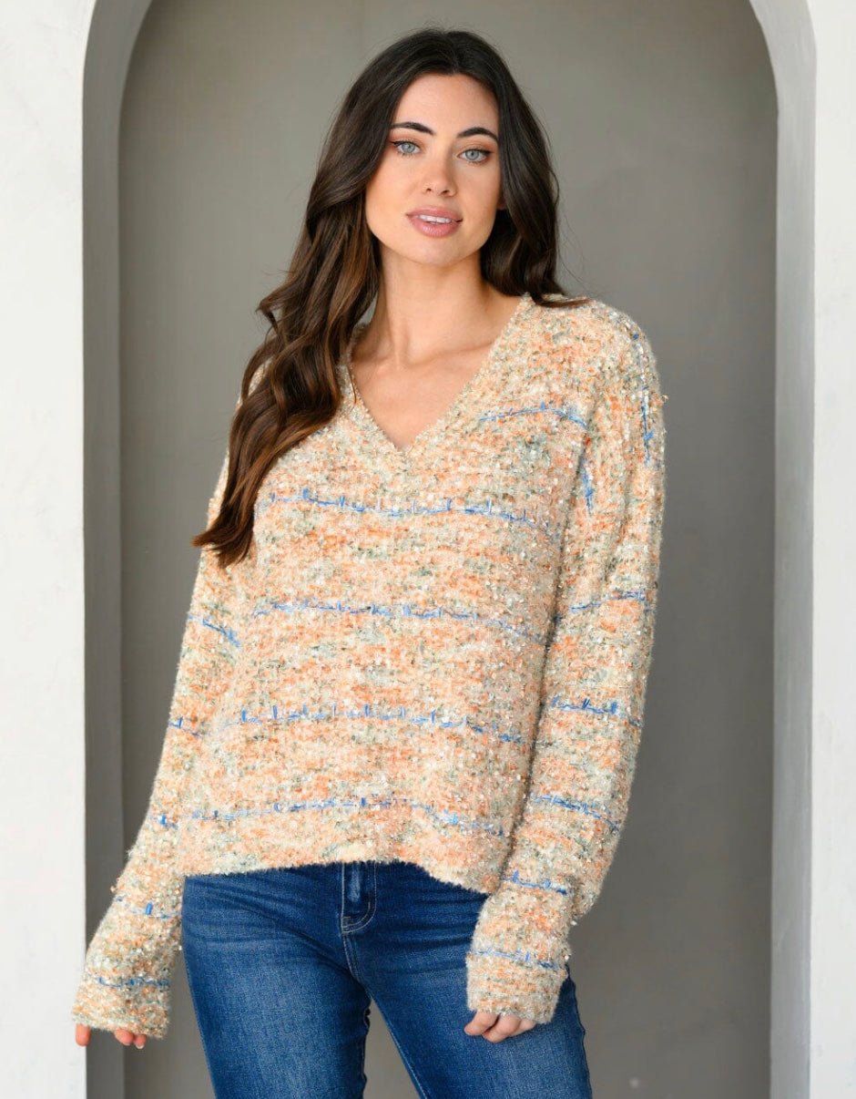 Ayla - Chunky, Colorful Chenille V-Neck Sweater showcasing vibrant threads and luxurious texture for a stylish and cozy look.